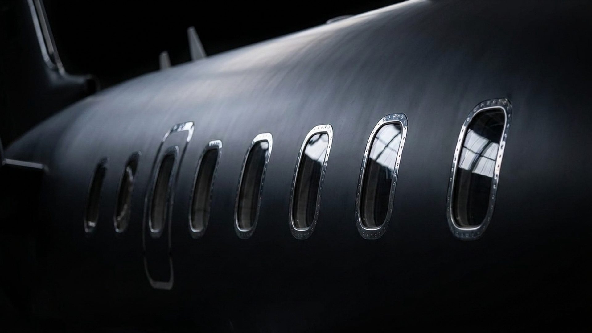 Full side profile of a Bombardier Challenger 350's cabin windows, Jettset Global about page